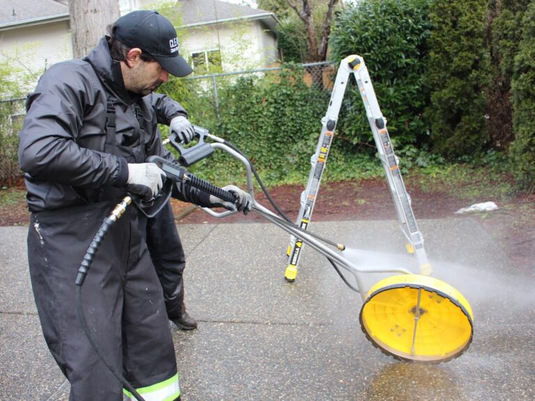 Cleany X pressure washing a driveway with a surface cleaner