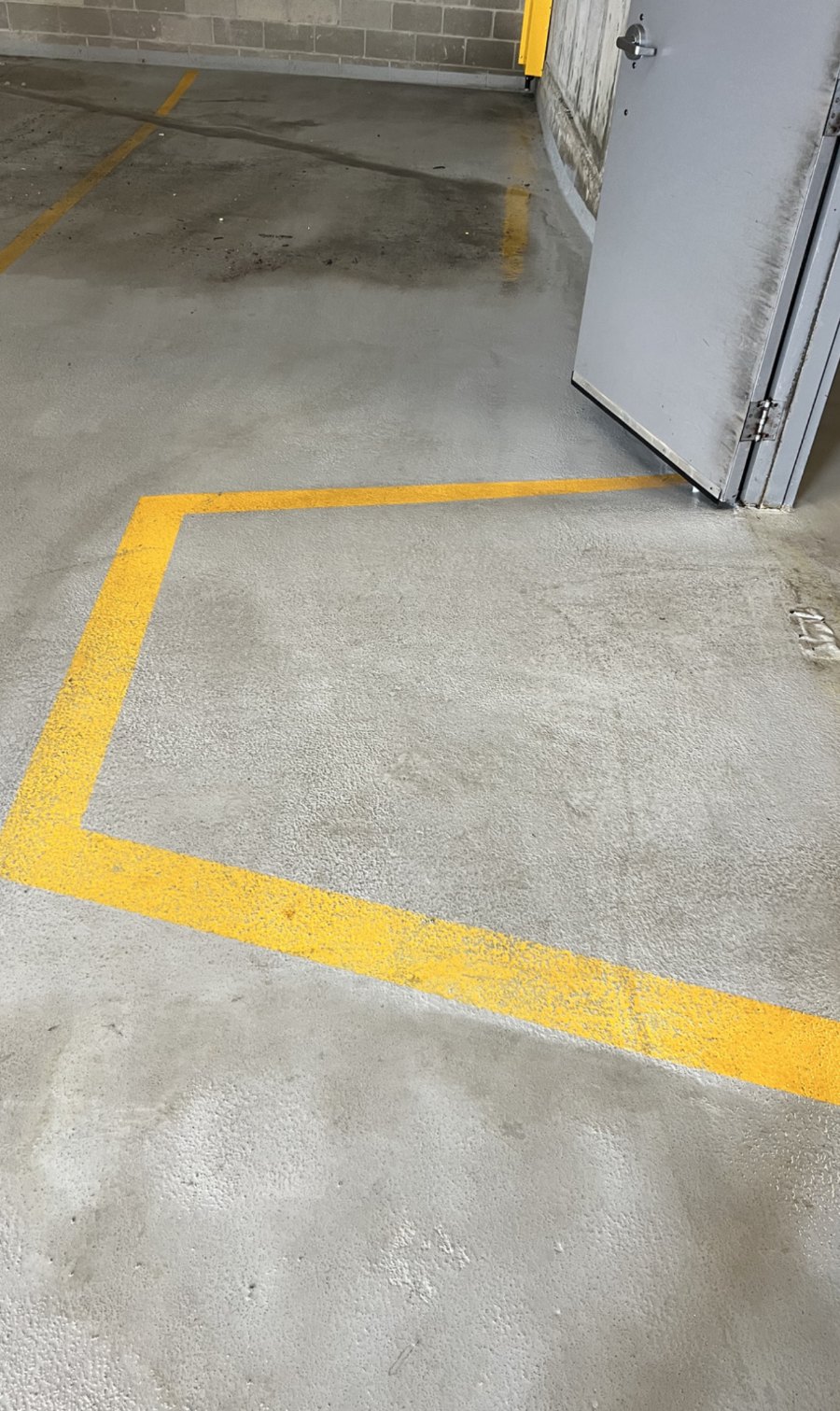 The same parkade floor after pressure washing by Cleany X