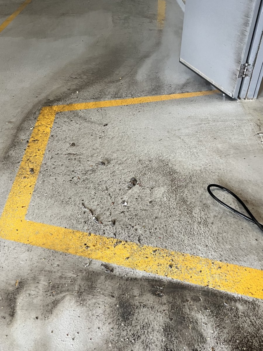Parkade floor before pressure washing by Cleany X
