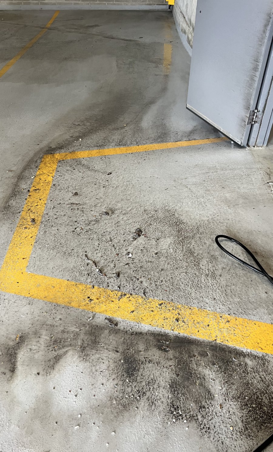 Parkade floor before pressure washing