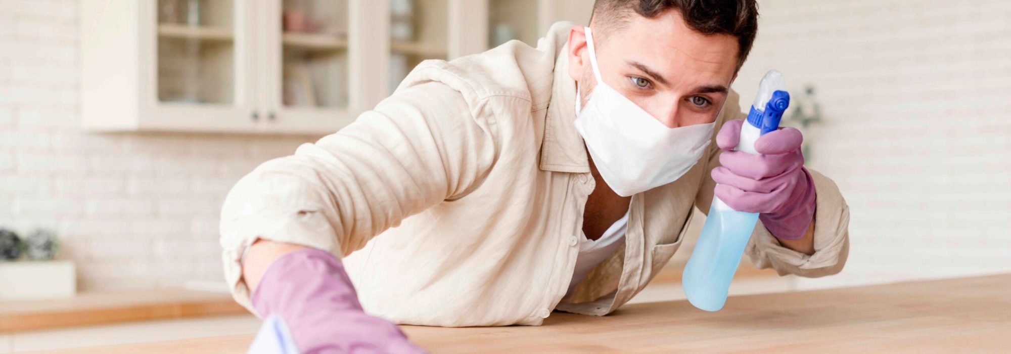young-man-holding-disinfectant
